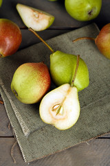 Ripe tasty pears on table close up