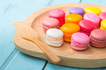 Macarons buttercream on the old  wood.