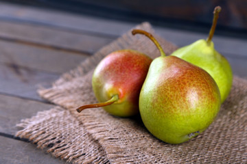 Ripe tasty pears on table close up