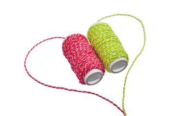 Threads heart shape on white isolated background