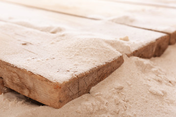 Sand with wooden planks, closeup