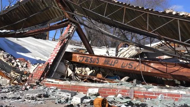 Graffiti decorates businesses abandoned and destroyed by the rioting in Ferguson, Missouri.