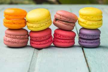 Macarons buttercream on the old  wood.