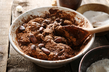 Preparing dough for chocolate pie on table close up