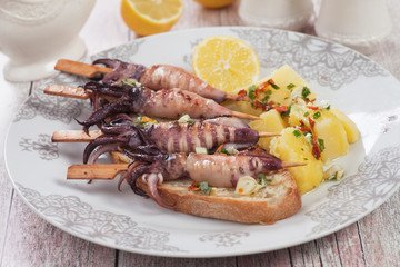 Grilled squid skewer with boiled potato