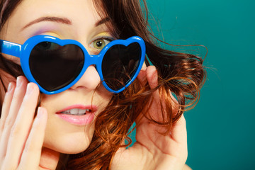 Girl in blue sunglasses portrait