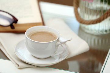 Cup of coffee on table close up