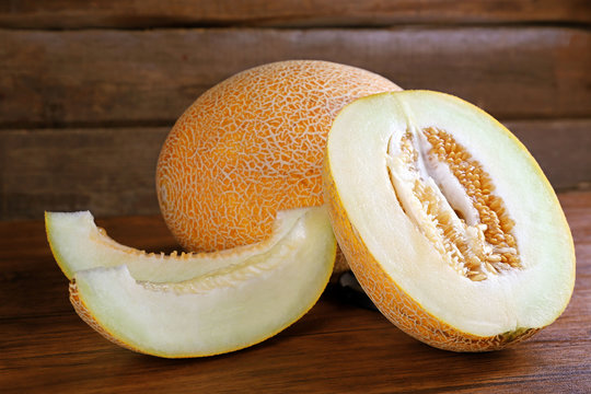 Ripe melon on wooden background