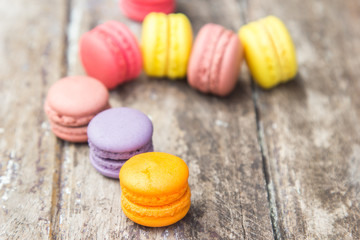 Macarons buttercream on the old  wood.