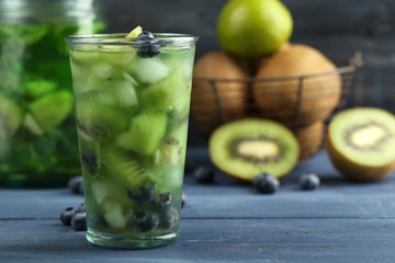 Kiwi and Blueberry cocktail on wooden background