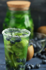 Kiwi and Blueberry cocktail on wooden background