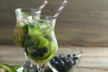 Kiwi and Blueberry cocktails on wooden background