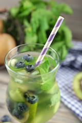Kiwi and Blueberry cocktail on wooden background