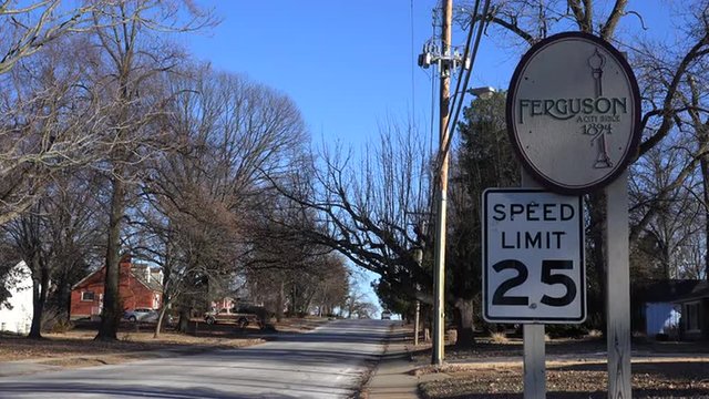 Roadside sign indicates an entrance to a suburban neighborhood in Ferguson, Missouri.