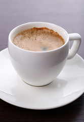 Cup of coffee on table close up