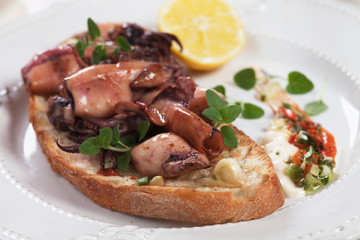Grilled squid on toasted bread