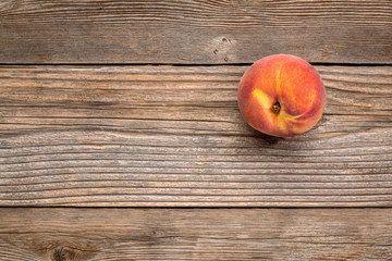 peach fruit on weathered wood