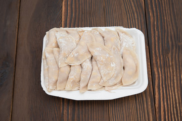 top view homemade dumpling filled with meat and corn on wooden board