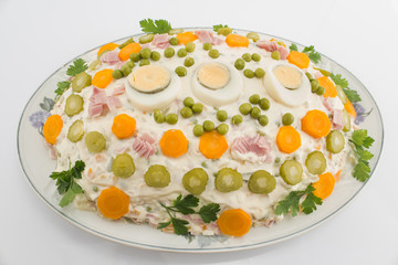 Russian salad on porcelain plate