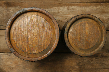Old wine barrels on wooden background