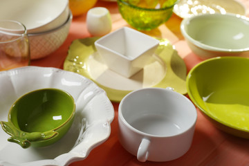 Different tableware on wooden table close up
