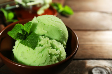Homemade mint ice-cream on dark wooden background