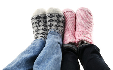Human feet in knitted socks isolated on white