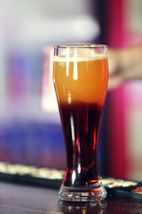 Cold beer glass on bar or pub desk