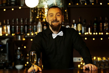 Portrait of handsome bartender at  work
