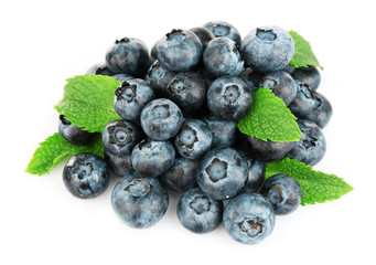 Fresh blueberries with mint isolated on white