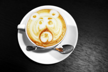 Cup of coffee on wooden table close up