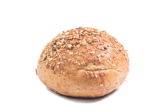 Fresh whole grain bread cut in half on white background
