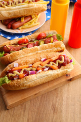 Fresh hot dogs on wooden background