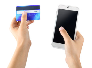 Female hands holding smartphone and credit card, isolated on white