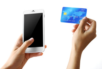 Female hands holding smartphone and credit card, isolated on white