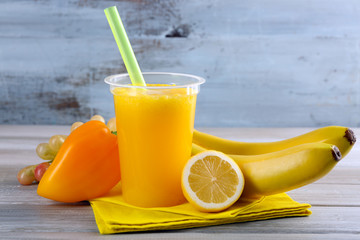 Fresh juice mix fruit, healthy drinks on wooden table, on bright background
