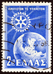 Naklejka premium Rotary Emblem and Globe (Greece 1956)