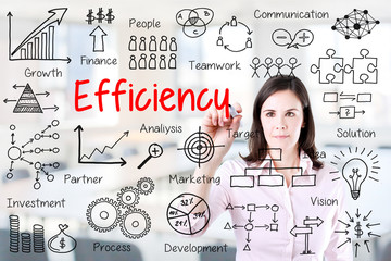Fototapeta premium Young business woman writing concept of efficiency business process. Office background.