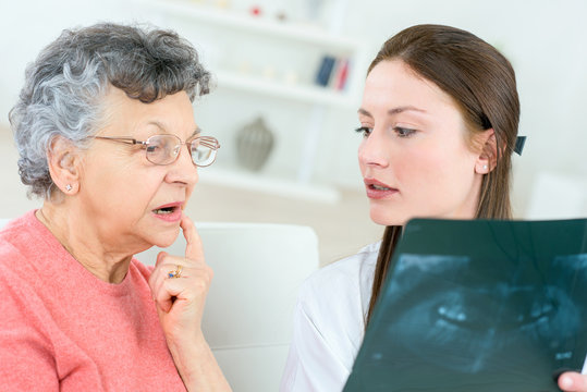Showing senior patient an x-ray