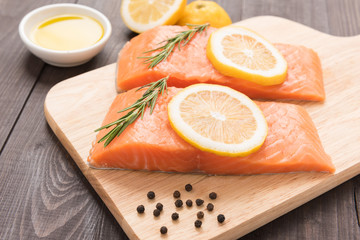 Fresh salmon and lemon on the wooden table