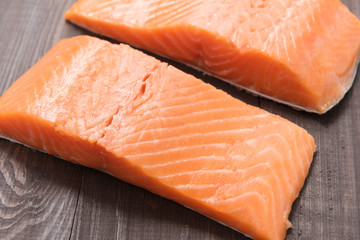 Fresh salmon on the wooden table. Top view