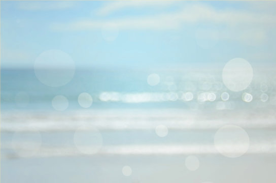 Blur beach with bokeh wave abstract background.