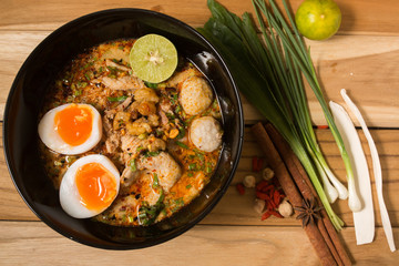 Thai noodle soup in a bowl taste spicy noodle soup and boiled eg