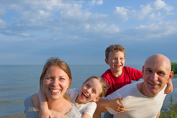 Fototapeta na wymiar happy family having fun outdoors