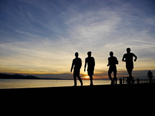 Fototapeta na wymiar silhouette of a jogger in sunrise