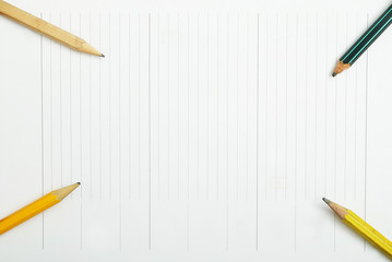 blank notebook with space for your text with pencils around