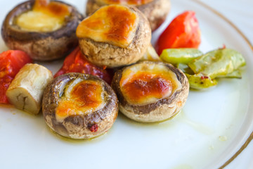 Mushrooms baked with cheddar cheese.