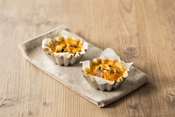 Mini quiche on a wooden table