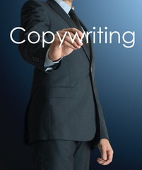 businessman writing Copywriting and drawing some sketches