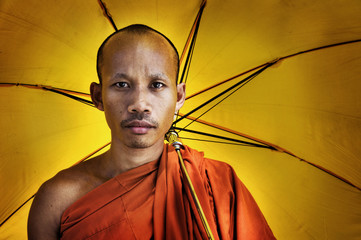 Buddhist monk holding umbrella Ceremony Concept